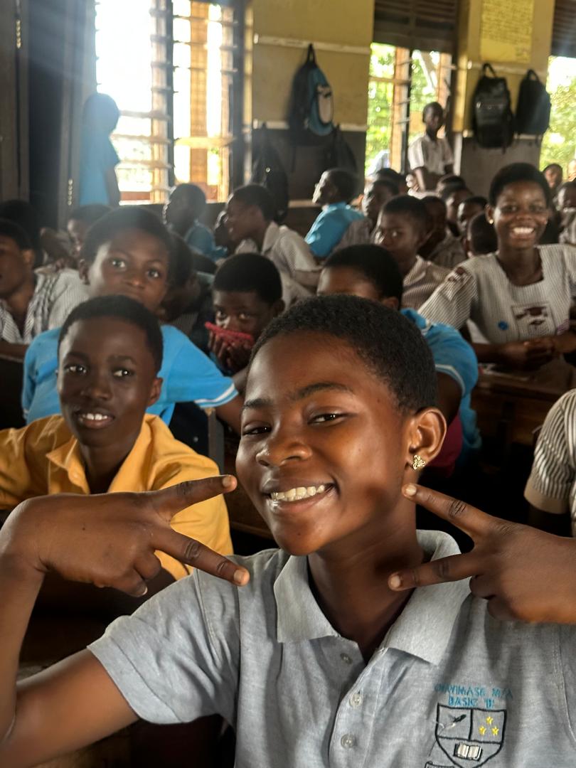 A smiling student during a Passion for Humanity Ghana school outreach